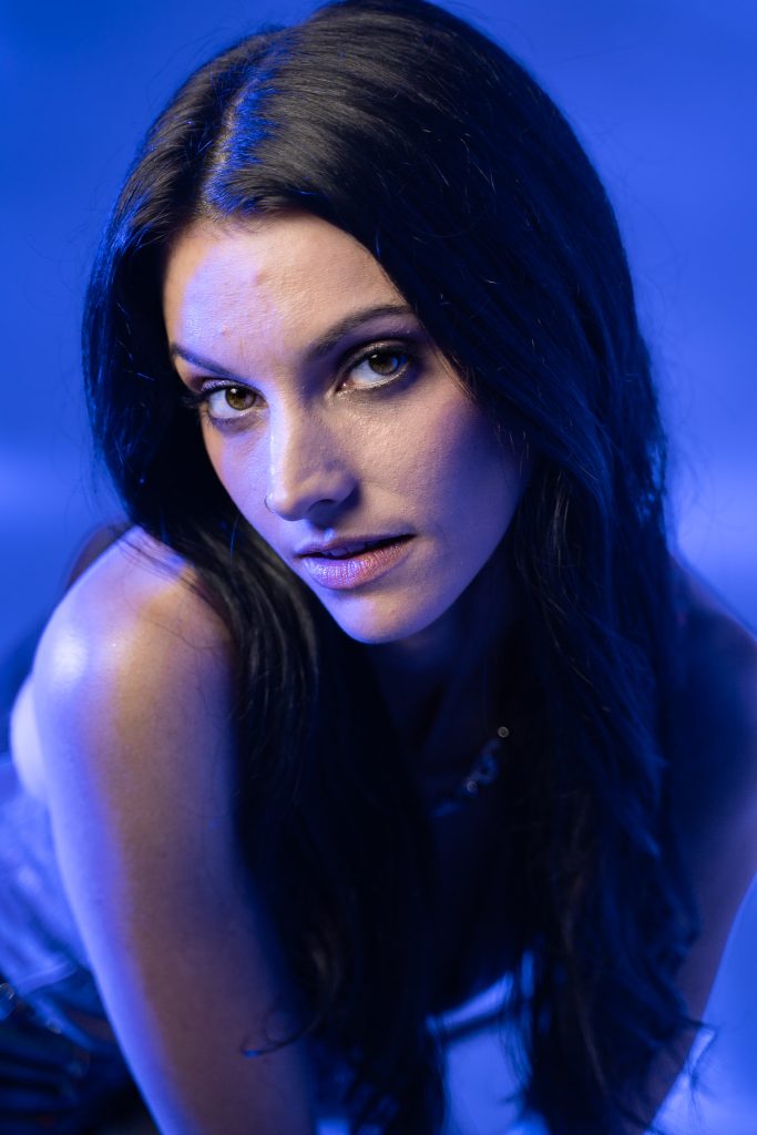 Close up creative light photo of a woman with a blue and white light background. Lyssa Benavidez Photography Elkhorn, NE Lyssab.com studio photography. 