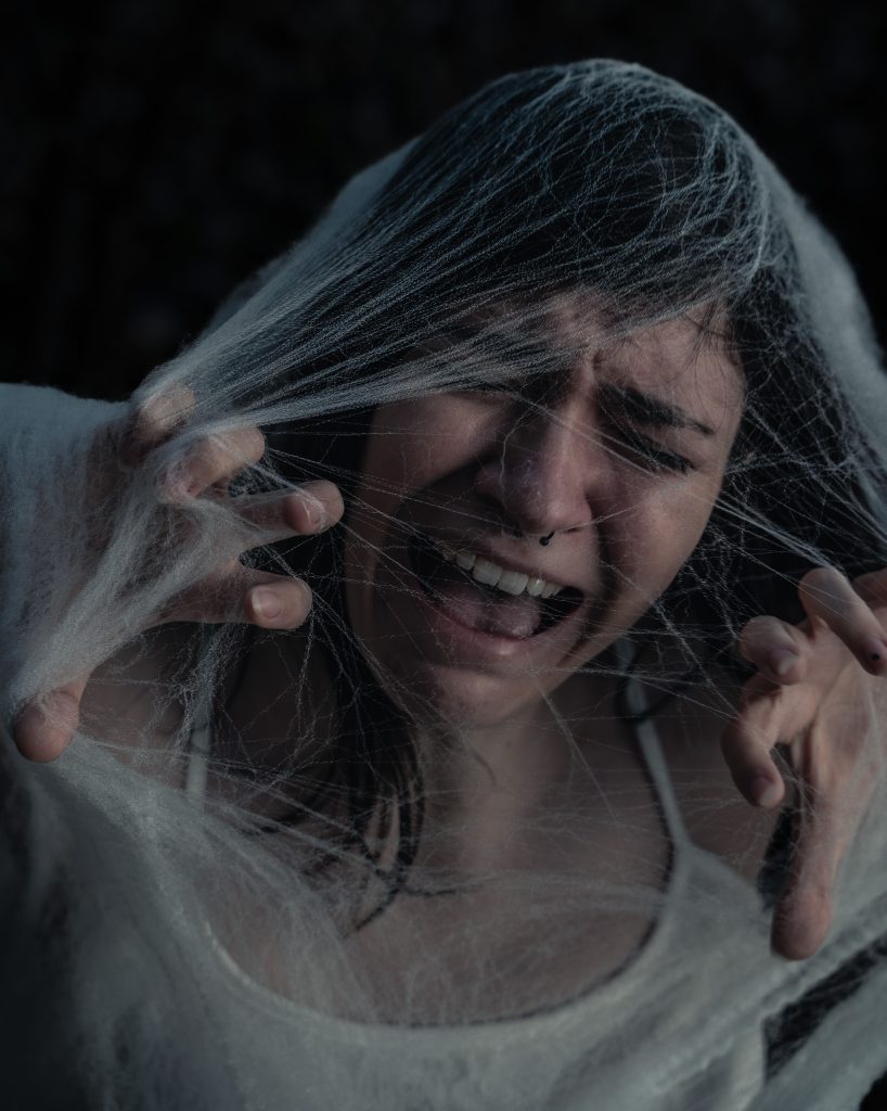 Surrealist portrait of a woman screaming under spiderwebs. Lyssa Benavidez Photography Elkhorn, NE Lyssab.com Fine Art Photography surrealist photography