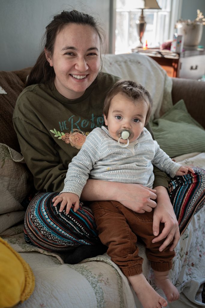 Lifestyle portrait of a little boy and his mom sitting on a couch together. Lyssa Benavidez Photography Elkhorn, NE Lyssab.com lifestyle family photography. 